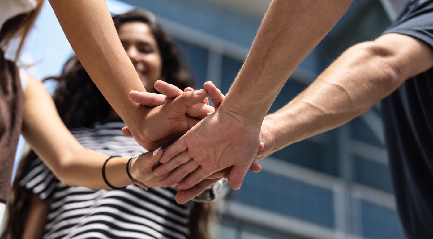 Hands joined together in partnership